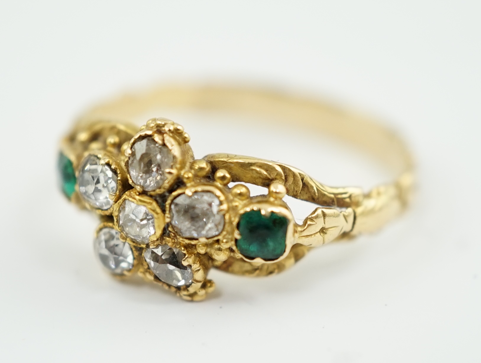 A Victorian gold, emerald and diamond set cluster ring